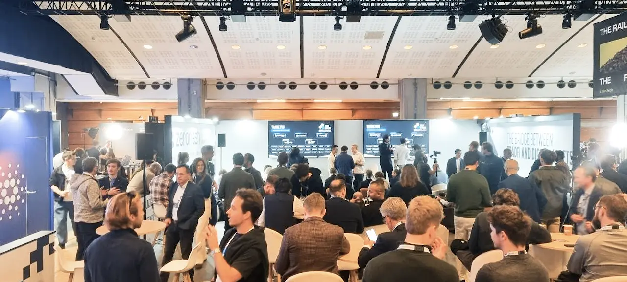 Active Q&A and project presentation area at Paris Blockchain Week 2026 with attendees and speakers.